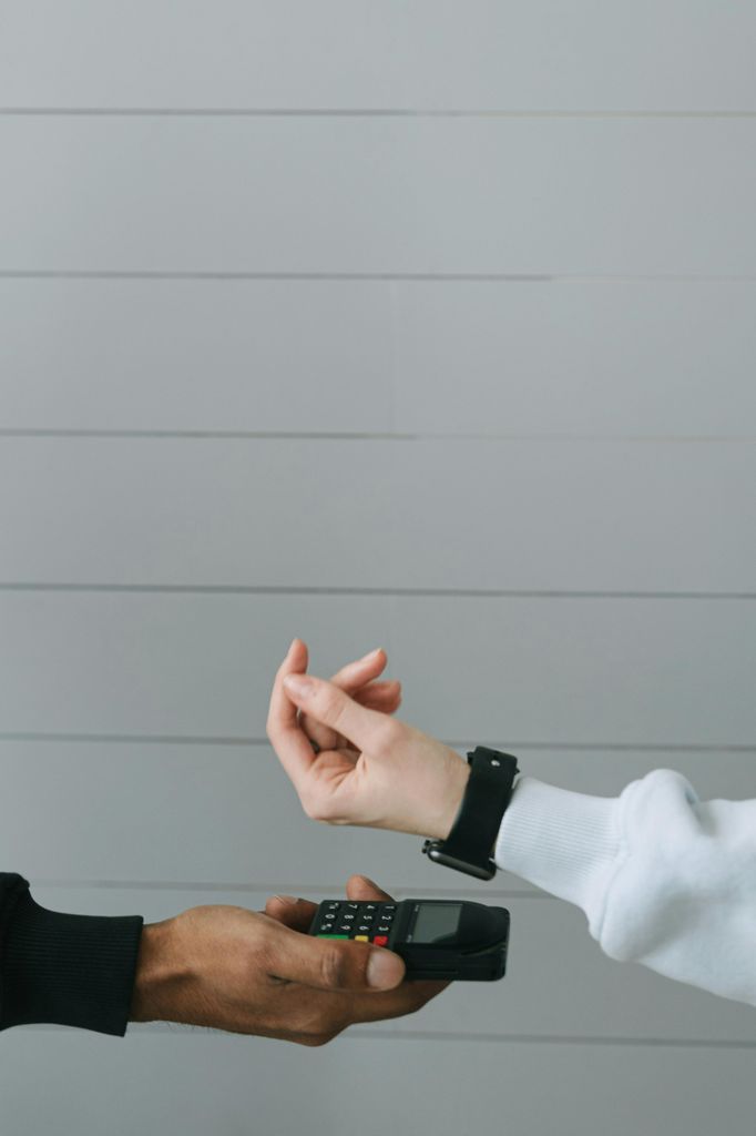 Person in White Long Sleeve Shirt Wearing Smartwatch