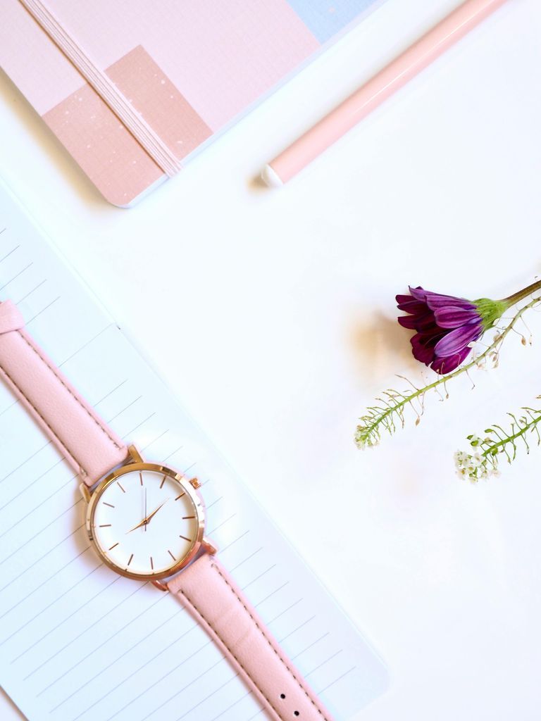 Round Gold-colored Analog Watch at 2:46 on Top of White Paper